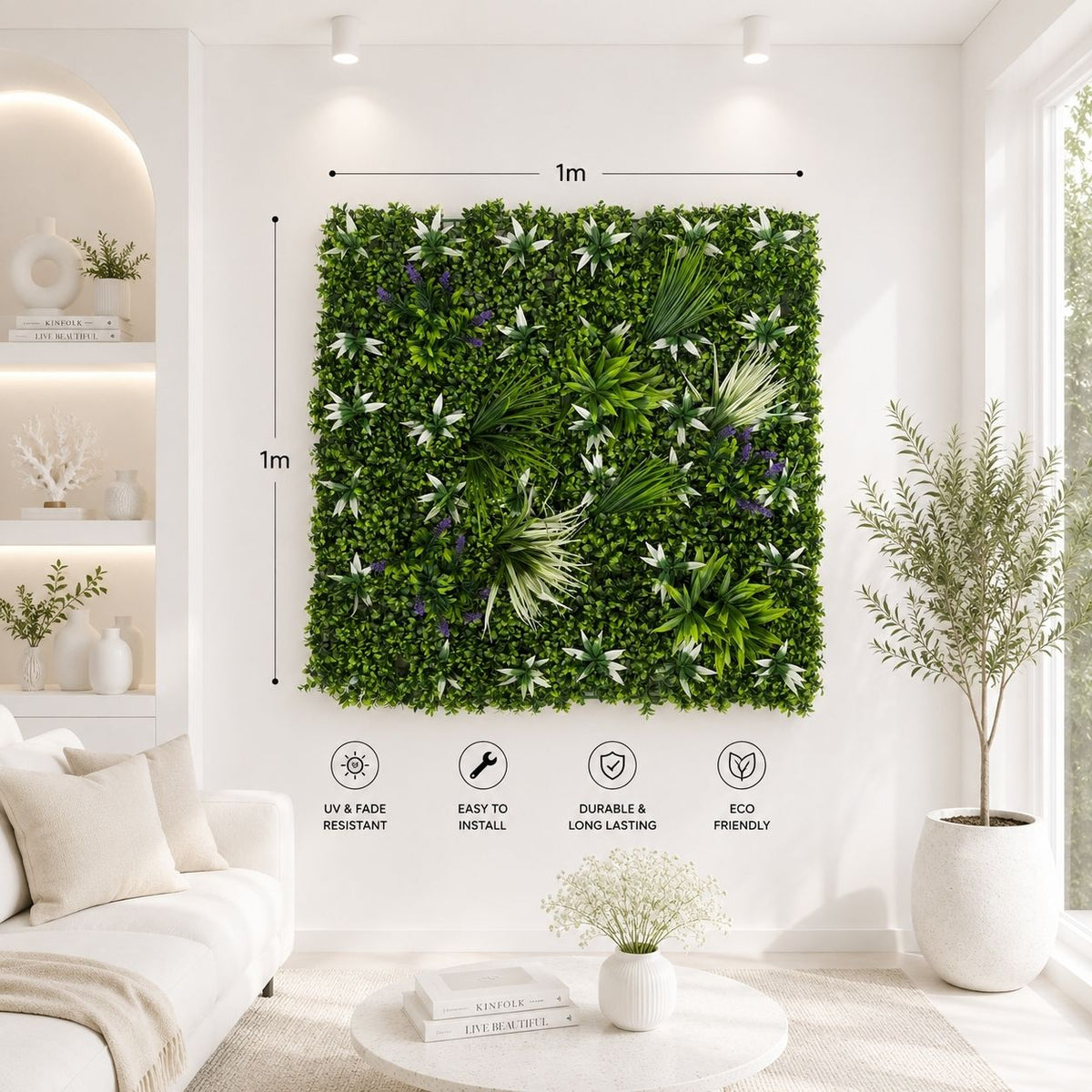 A square green living wall made of dense artificial foliage and palm leaves hangs on a white wall in a bright modern living room. Black dimension lines show the vertical garden product is 1m by 1m, with feature icons below reading UV and fade resistant, easy to install, durable and long-lasting, and eco friendly.